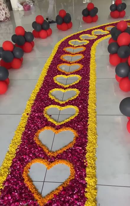 Romantic Anniversary Walkway With Red And Yellow Petal Hearts And Balloon Clusters - anniversary room decoration by ARV Decor