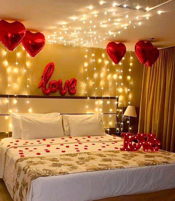 Romantic Anniversary Room Decor With Red Heart Balloons And Fairy Lights