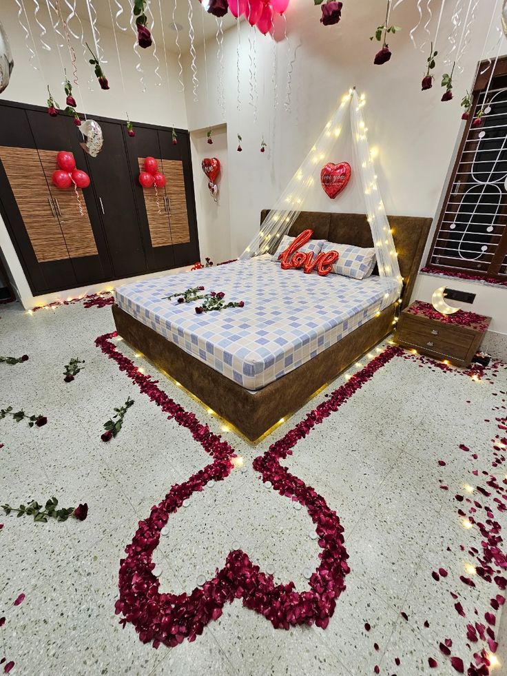 Romantic Anniversary Room Decoration with Red Balloons, Rose Petals, and Love Lights - anniversary room decoration by ARV Decor