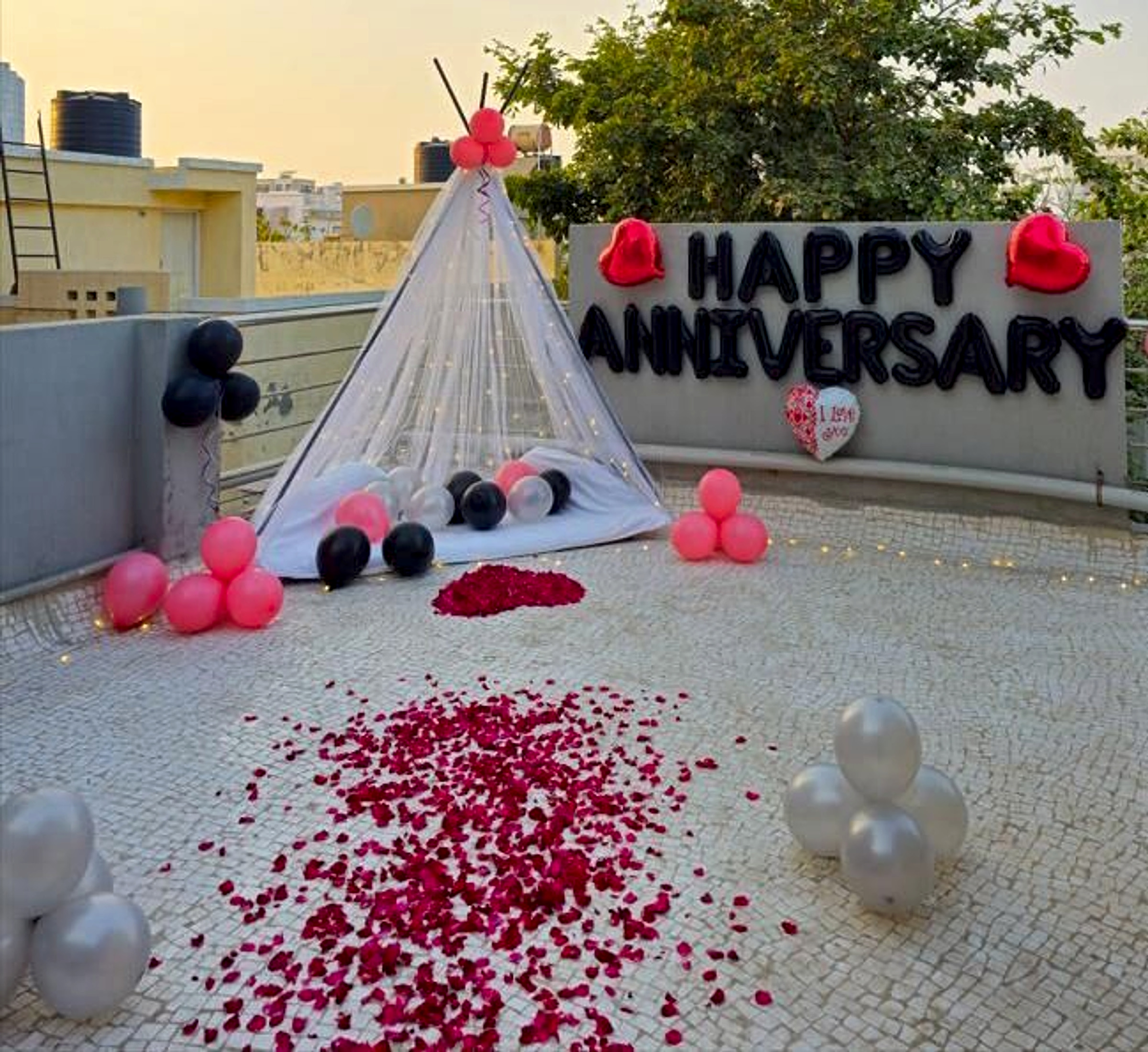 Romantic Red And Black Anniversary Decor With Teepee Tent And Rose Petal Path - romantic bedroom decor by ARV Decor thumbnail 2