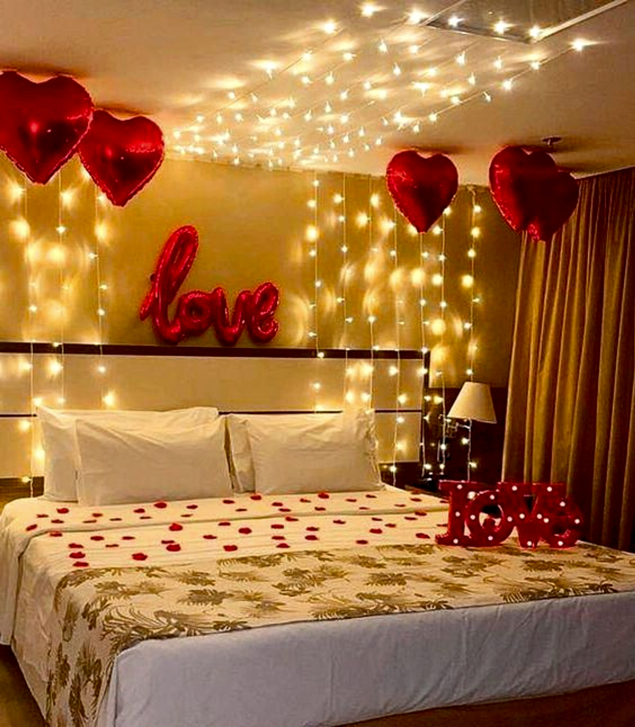 Romantic Anniversary Room Decor With Red Heart Balloons And Fairy Lights - Romantic theme by ARV Decor thumbnail 2