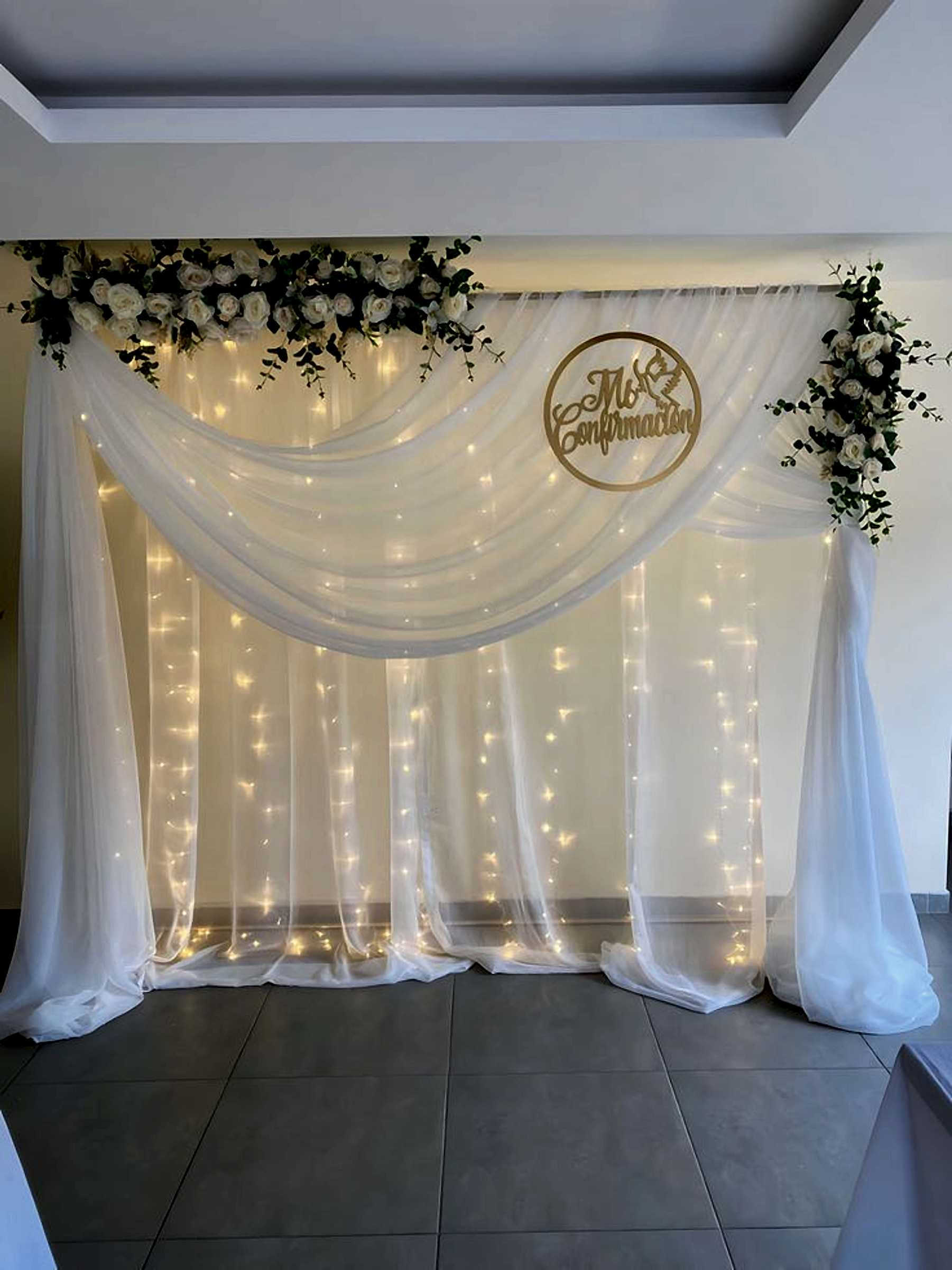 White And Green Confirmation Backdrop With Floral Drapes And Fairy Lights - Engagement by ARV Decor thumbnail 2