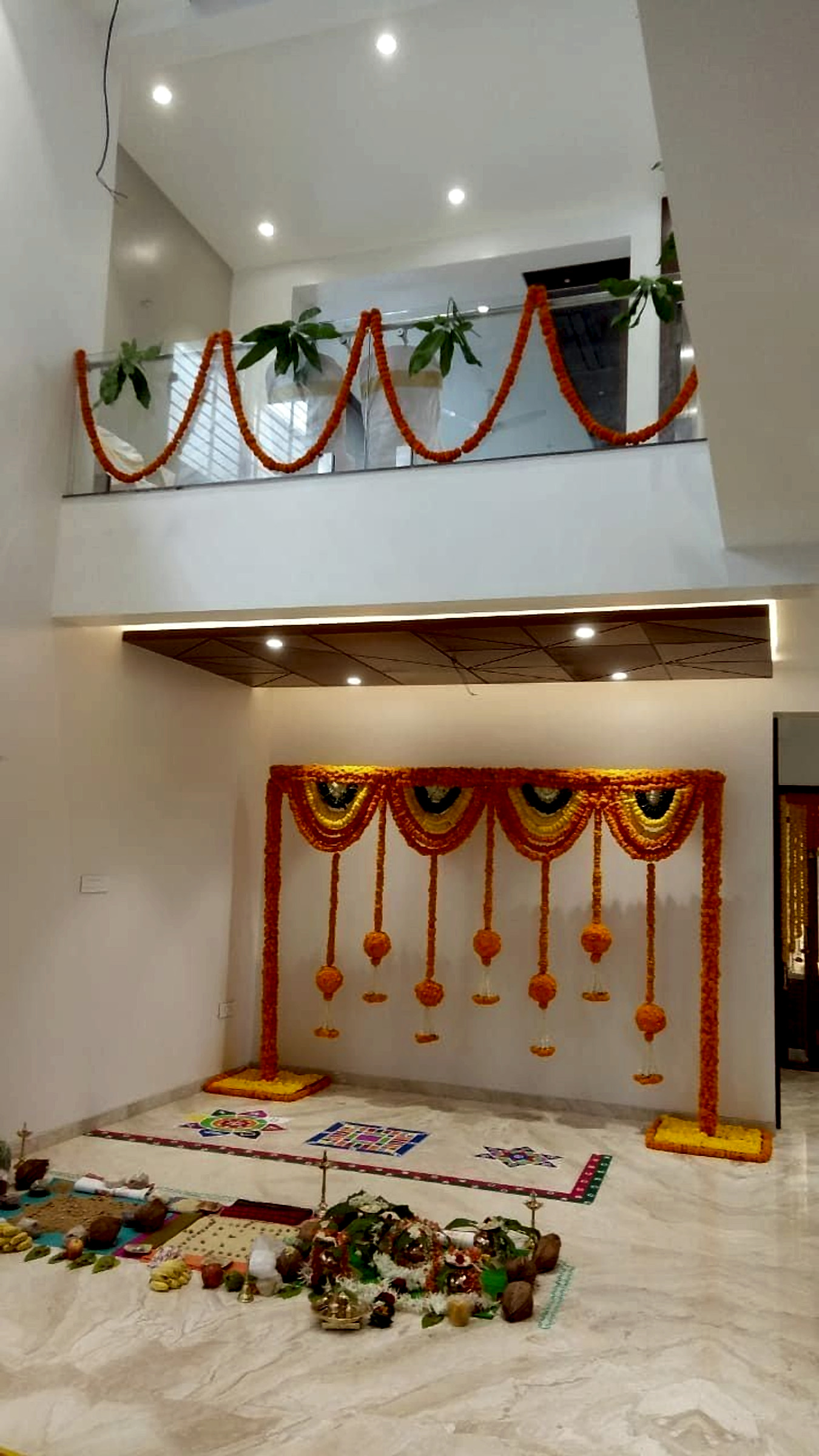 Traditional Marigold Floral Backdrop And Rangoli Decor For Home Pooja Ceremony - Housewarming by ARV Decor thumbnail 2