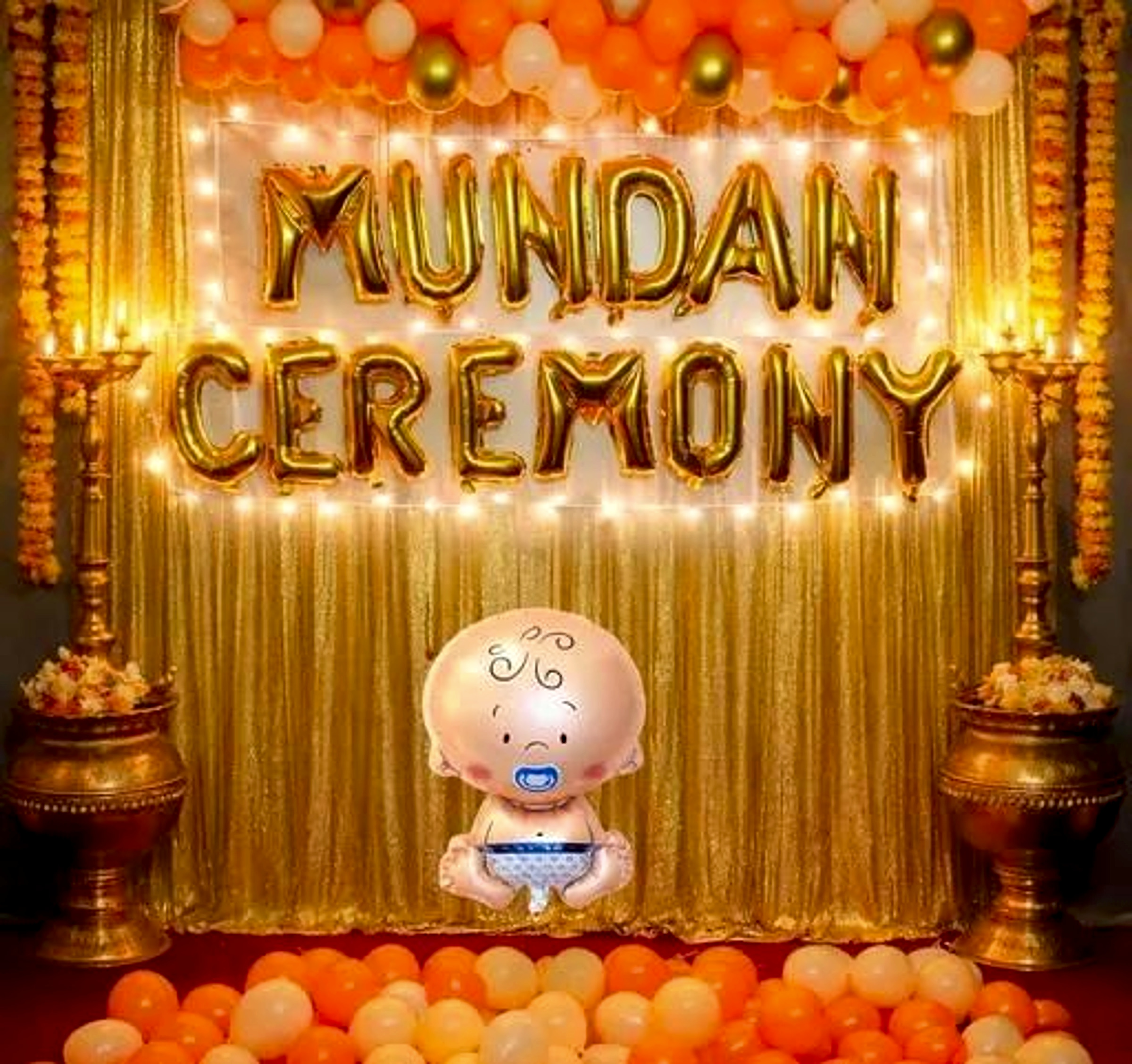 Traditional Mundan Ceremony Decor With Gold Backdrop And Orange Balloon Garland - Baby world by ARV Decor thumbnail 2