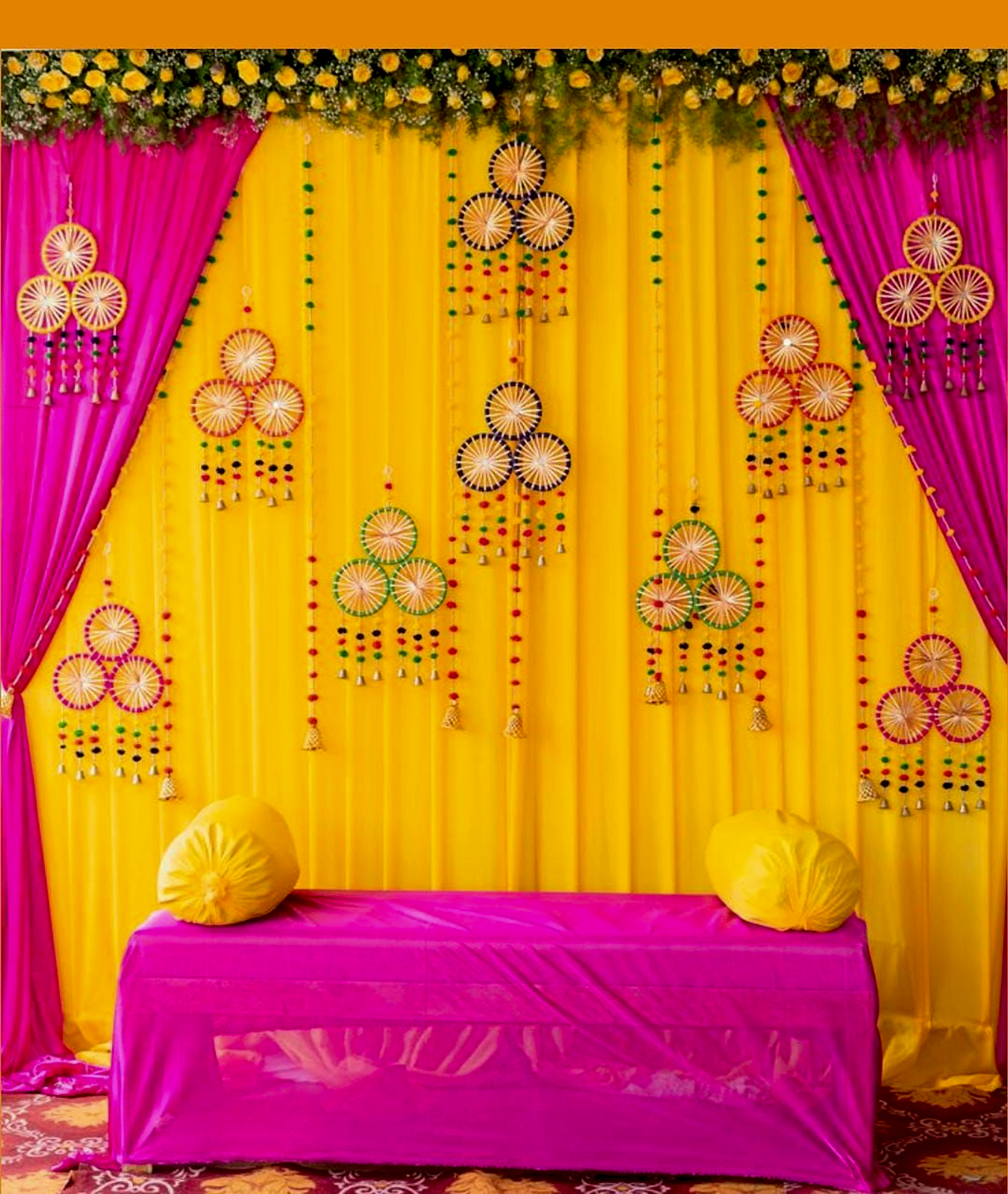 Traditional Wedding Haldi Stage With Yellow And Pink Fabric Backdrop - Wedding Knots by ARV Decor thumbnail 2